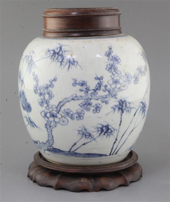 A Chinese Three Friends blue and white ovoid jar, early 18th century, height 27cm including wood stand and cover